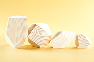 Wooden blocks on yellow background