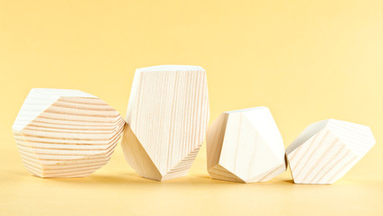 Wooden blocks on yellow background