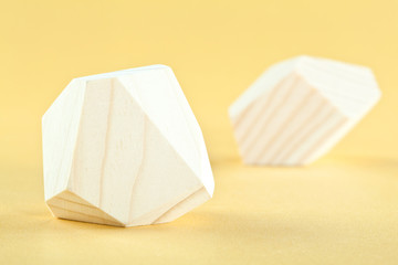 Wooden blocks Tumi-ishi on yellow background