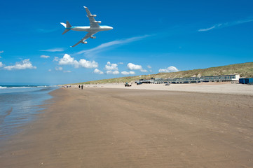 Aircraft flying over a beach