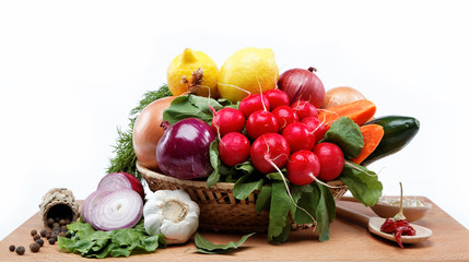 Healthy food. Fresh vegetables and fruits on a wooden board.