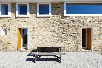 Fototapeta na wymiar holiday home in the mountains, outdoor view, stone facade