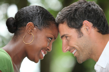 Couple rubbing his forehead