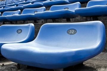 Fototapeta premium blue ordered rubber seats in a sports track field