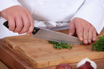 Chopping parsil.