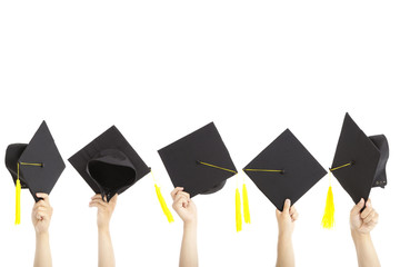 many hand holding graduation hats and isolated on white