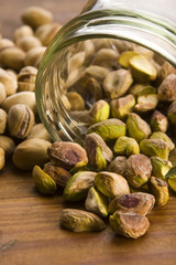 Roasted pistachios on natural wooden table