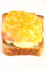 a sandwich with cheese, onions and sausage