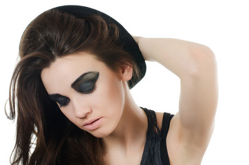 Fototapeta premium Portrait of the beautiful girl in a hat - grunge style