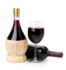Full red wine glass goblet and bottle