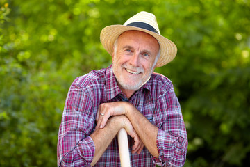 Portrait of senior gardener with straw hat