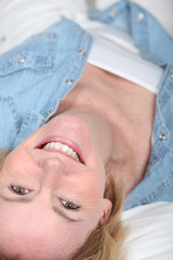 Fototapeta na wymiar mature woman lying in her bed