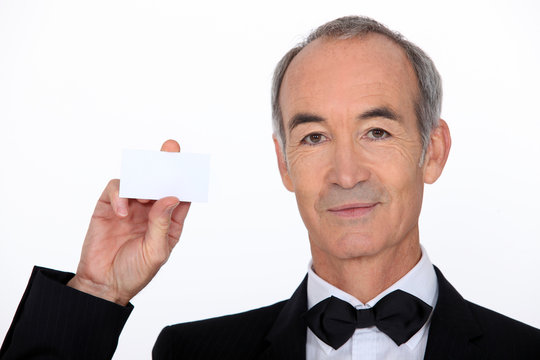 Waiter holding business card
