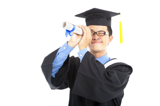 young graduating student watching by diploma