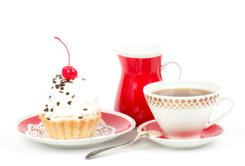 Dessert - sweet cake with cherry on a plate on background