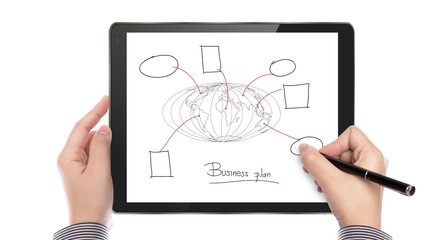 Business man write business plan on touch screen device