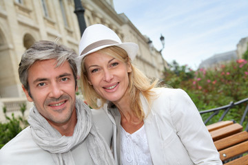 Happy couple doing shopping in town