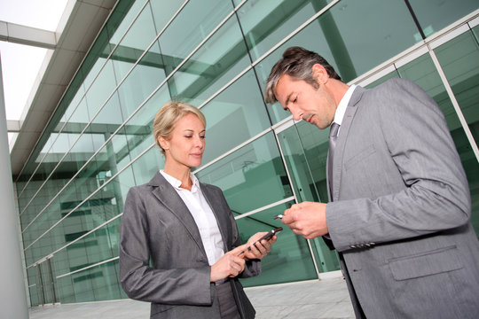 Business People Exchanging Phone Numbers