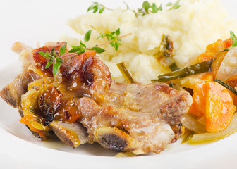 Veal ribs with mashed potato and vegetables