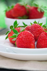 Fresh strawberries in white bowl