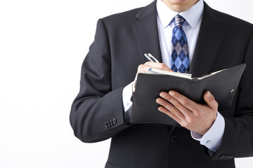 メモを取るビジネスマン