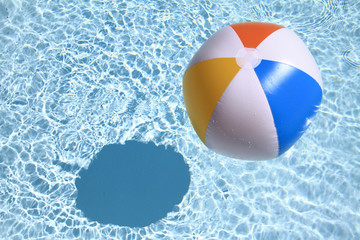 Summer background. Beach Ball on the swimming Pool