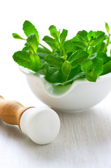 Fresh mint in a ceramic mortar