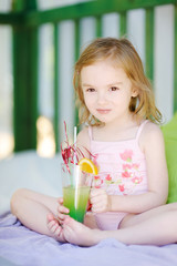 Cute little girl drinking cocktail © MNStudio