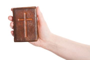 Hand holding the old bible