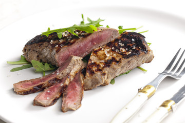 grilled beefsteak pickled in Dijon mustard with ruccola
