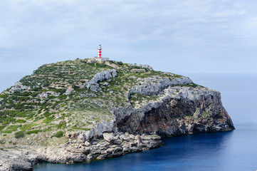 Cabrera island. Old lighthouse on the rock cape.