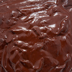 molten liquid dark chocolate  as a food background or texture