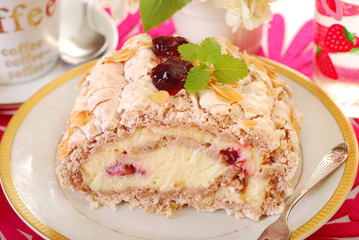 meringue swiss roll with cherry and almonds