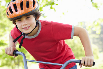 Naklejka premium Boy riding bike