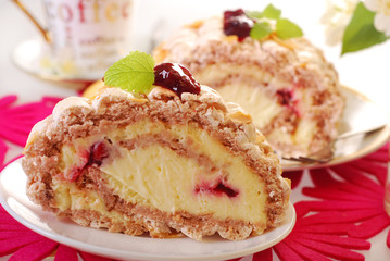 meringue swiss roll with cherry and almonds