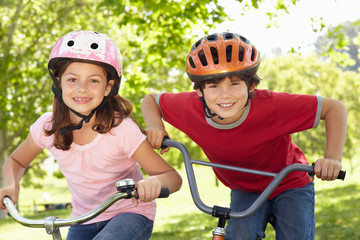 Boy and girl riding bikes