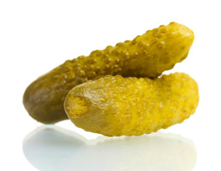 Two marinated cucumbers isolated on white