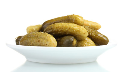 Marinated cucumbers on the plate isolated on white
