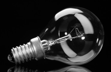 Light bulb on black background