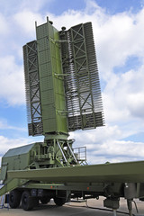 The military aerial of a radar against the blue sky