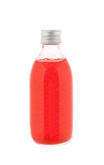 Close up on a medicine bottle with red syrup isolated on a white