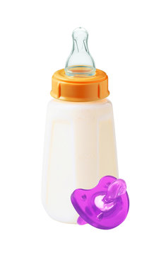 baby milk bottle and dummy isolated on white background