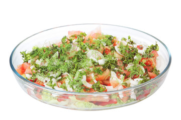Vegetable salad in a glass dish.