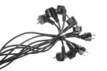 The group of cables with plugs. On a white background, closeup.