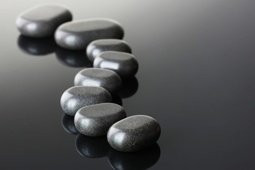 Spa stones on grey background