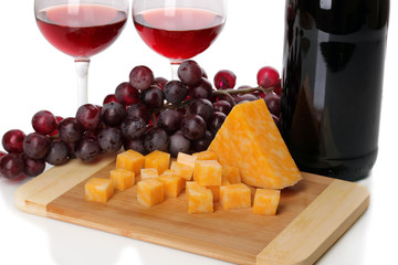 Bottle of great wine with wineglasses and cheese isolated