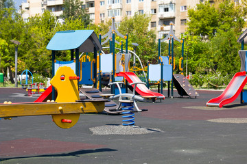 Fototapeta premium Playground in Bucharest / Children park against communist flats