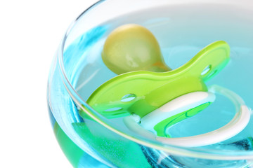 Baby dummy with alcoholic beverage isolated