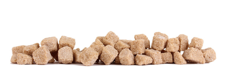 Lump brown cane sugar cubes isolated on white