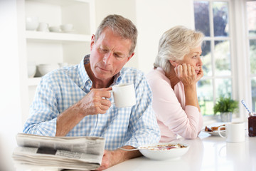 Retired couple eating breakfast